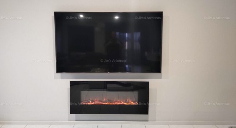 CAN AN ELECTRIC FIREPLACE GO UNDER A MOUNTED TV?