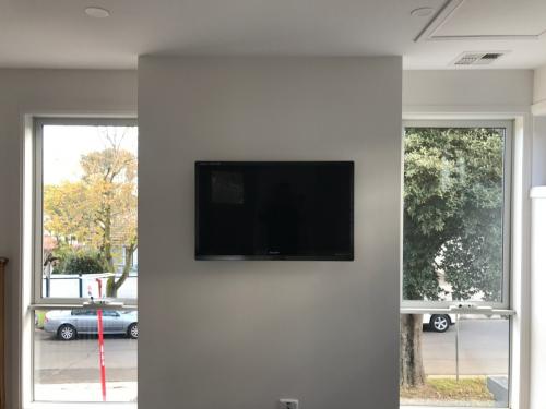 Lounge with centre Wall Mounted TV by Jim's Antennas